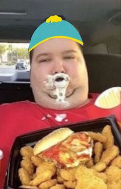 a man with food in his mouth sitting in the back seat of a car,