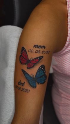 a woman's arm with two butterflies on it and the words mom, dad, and son written in black ink