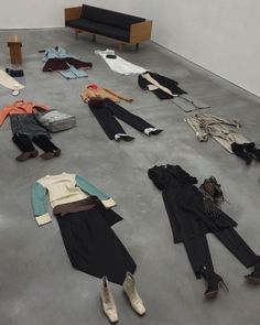 several pieces of clothing are scattered on the floor