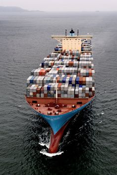 a large container ship in the middle of the ocean