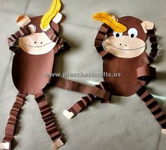 two monkey puppets made out of toilet paper