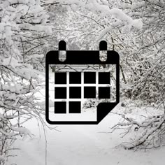 a black and white photo of a snow covered path with a calendar in the middle