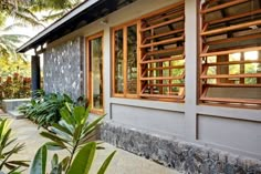 an exterior view of a house with wooden shutters