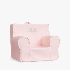 a pink children's chair with the word chloe on it, sitting in front of a white background