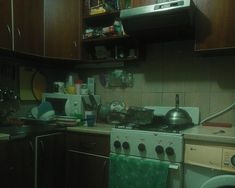 the kitchen is cluttered with dishes and appliances