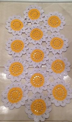 crocheted doily with yellow and white flowers