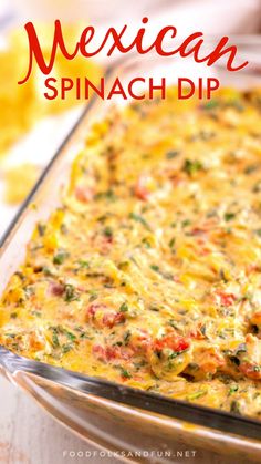 a glass casserole dish filled with cheese and vegetables next to some potato chips