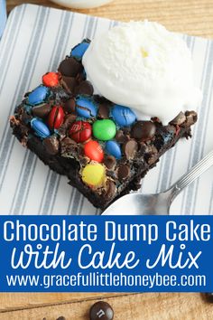 chocolate dump cake with m & m candy bars and whipped cream on top