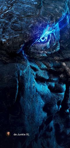 an image of a blue dragon eye in the night sky with its eyes glowing brightly