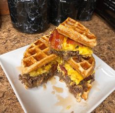 a close up of a waffle sandwich on a plate