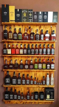 a wooden shelf filled with lots of bottles