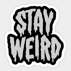 sticker with the words stay weird in white and black lettering on top of it