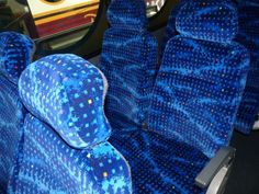 the seats are covered in blue fabric