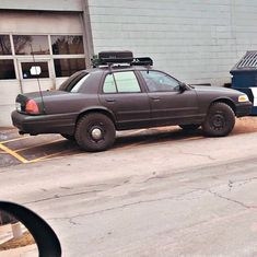 a police car parked in front of a building