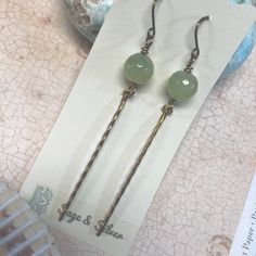 New Calming & Alluring , Contemporary Earrings Made Of Genuine Aventurine In A Soothing Pale Green. Dangling From It Is A Long Slender Spear Of Natural Brass For Earthy , Woodsy Appeal. A Little Over 3” Long. Aventurine Is Thought To Be A Calming Stone & Aid In Bringing Prosperity To Your Life. Non Tarnish Copper Ear Wires. Made By Me New, Never Worn Non Tarnish Copper Ear Wires New Earrings Pale Green Sea Foam Brass Spears Boho Hippie Artsy Contemporary Slender Goth Rock Goth Rock, Contemporary Earrings, Calming Stones, New Earrings, Green Sea, Jade Beads, Pale Green, Sea Foam, Green Brown