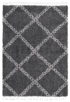 a rug with grey and white squares on the bottom, in front of a white background