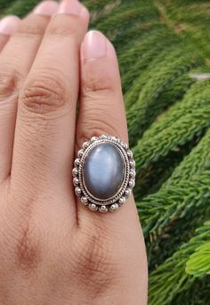 Name of Stone: Moonstone Cut: Smooth Color : Gray Shape: Oval Stone Size: 11 x 15 mm Ring's Weight: 7.20 Gram Country of Origin: Indian Treatment: Natural * Cut & Polished in India * 100% natural & genuine * Measurements & weight are close approximations * We take order work as well. Feel free to contact me for purchasing goods in bulk. * We are manufacturers & Wholesaler of Precious, Semi-precious Loose gemstones, Gemstones Beads, Loose Cabochon, Faceted Gemstone Beads, Chips, Un-Cut Beads etc. Cats Eye Ring, Mystic Quartz, Ring Halo, Bella Swan, Cabochon Ring, Eye Ring, Unisex Ring, Inspired Jewelry, Oval Stone