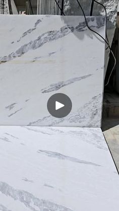 a white marble table top with a video player