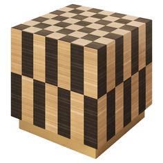 a wooden cube with black and white squares on it's sides, in the shape of a checkerboard pattern