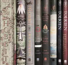 a row of books sitting on top of a shelf