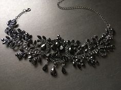 "This romantic and gothic style design wedding bridal choker necklace linked to cable chain finished with sparkle crystals at end for you to adjust the length. Size: necklace measures around 14.5\" long x center drop 3.1\" Color: dark silver with black rhinestone crystals and glass stones Item ship out with tracking number to you (around 10 to 14 business days for delivery). We also provide fast shipping service, around 3-4 business days delivery but need to add extra charge. Please convo us if Luxury Black Spinel Jewelry For Evening, Adjustable Gothic Style Necklaces For Wedding, Adjustable Gothic Style Necklace For Wedding, Gothic Black Choker For Evening, Black Gothic Choker For Evening Wear, Elegant Black Rhinestone Necklace For Wedding, Elegant Black Formal Choker, Gothic Black Party Jewelry, Gothic Black Necklace For Evening