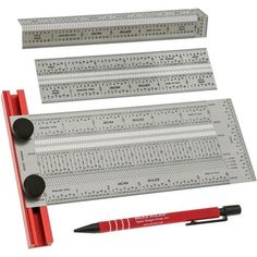 a ruler and pen are sitting next to each other