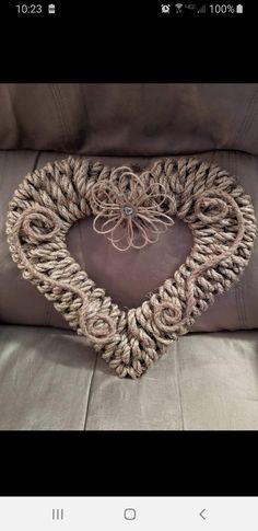 a heart shaped pillow made out of rope