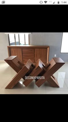 a wooden table sitting on top of a tiled floor