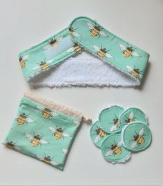 three pieces of cloth with bees on them