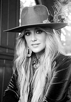 black and white photograph of a woman wearing a hat