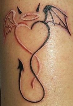 a tattoo on the leg of a woman with an angel wing and heart shaped tail