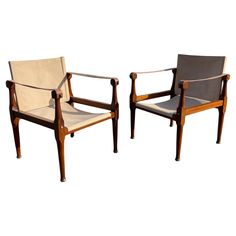 two chairs sitting next to each other on a white background