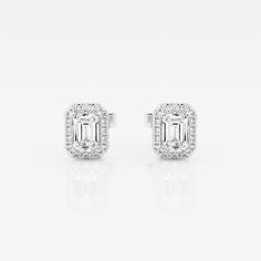 We can't keep these emerald stud earrings in stock. Styled with large emerald cut lab grown diamonds with a halo of round diamonds, these earrings are a true epitome of seductive glamor. Luxury Emerald Cut Lab Grown Diamond Earrings, Emerald Cut Diamond White Earrings In Fine Jewelry Style, Diamond White Emerald Cut Fine Jewelry Earrings, Emerald Cut Diamond White Earrings Fine Jewelry, Emerald Cut Diamond White Fine Earrings, Fine Jewelry Emerald-cut Lab Grown Diamond Earrings, Emerald Cut Diamond Earrings With Halo Design, Emerald Cut Halo Diamond Earrings, Formal Fine Jewelry Emerald Cut Diamond Earrings