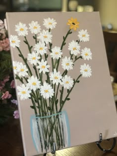 a painting of daisies in a glass vase on a table with flowers behind it