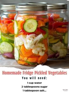 three mason jars filled with pickled vegetables on top of a wooden table next to each other