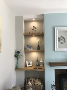 a living room filled with furniture and a fire place next to a painting on the wall