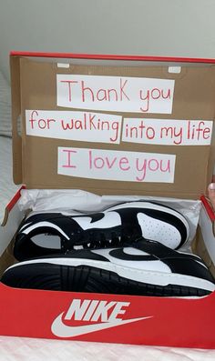 a pair of nike shoes in a box with thank you for walking into my life