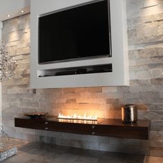 a television mounted above a fireplace in a living room