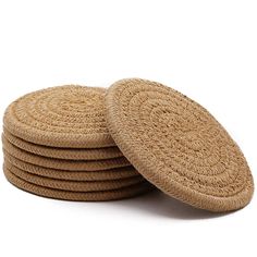 round straw coasters stacked on top of each other in front of a white background