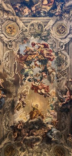 an ornate painting on the ceiling of a building