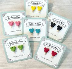 four small mickey mouse ear pins in different colors