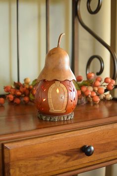 a wooden table topped with a lamp on top of it