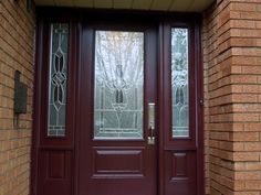 a red front door with two glass panels