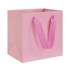 a pink shopping bag with a ribbon on the handle