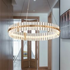 a circular chandelier hanging from the ceiling