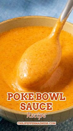 a spoon full of soup with the words poke bowl sauce recipe