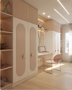 a room with white walls and wooden flooring, shelving unit in the middle