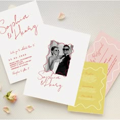 two wedding cards on top of each other with pink and yellow flowers in the background