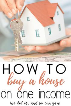 a person holding a house key with the words how to buy a house on one income we did it and so can you