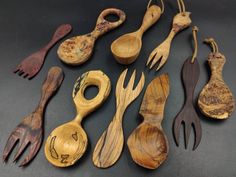 an assortment of wooden spoons and forks